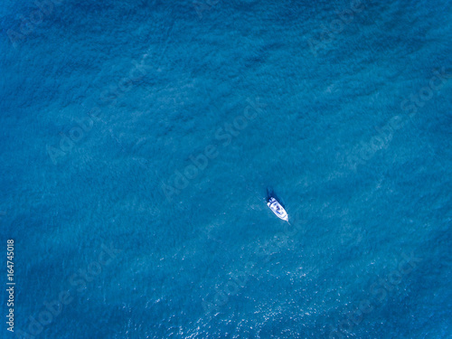 Fisherman boat in the ocean drone shot