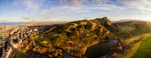 Aerial panoramic photograph of Edinburgh's Arthur's Seat Hill what is situated just to the east of the city centre, about 1 mile (1.6 km) to the east of Edinburgh Castle. Scotland, United Kingdom