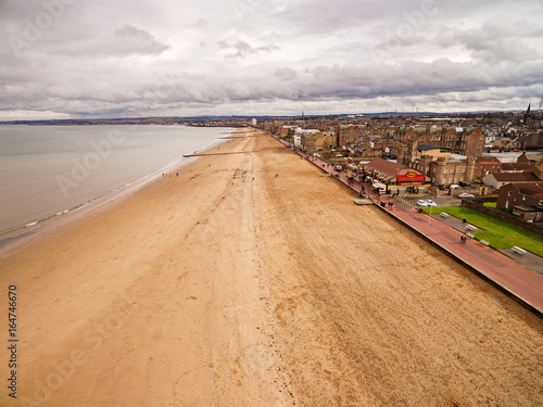 The long stretch of sandy beach of Portobello, Edinburgh's seaside viewed from the air. Scotland, United Kingdom © Andras