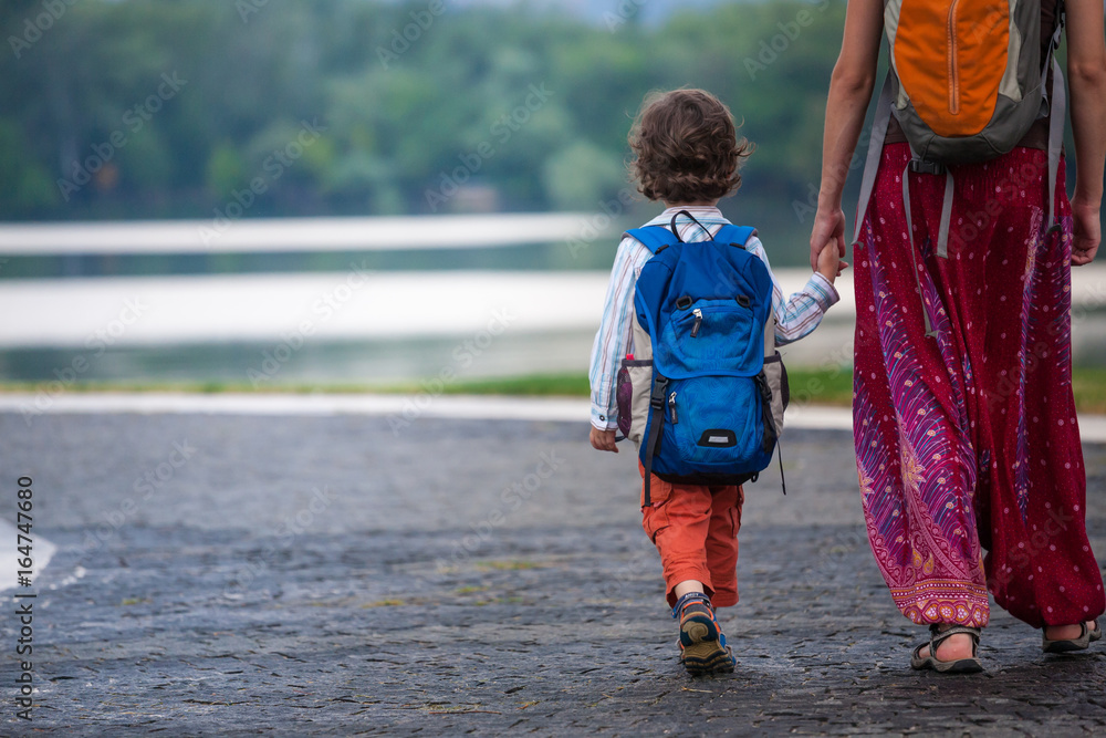 Fototapeta premium The child walks with his mother.