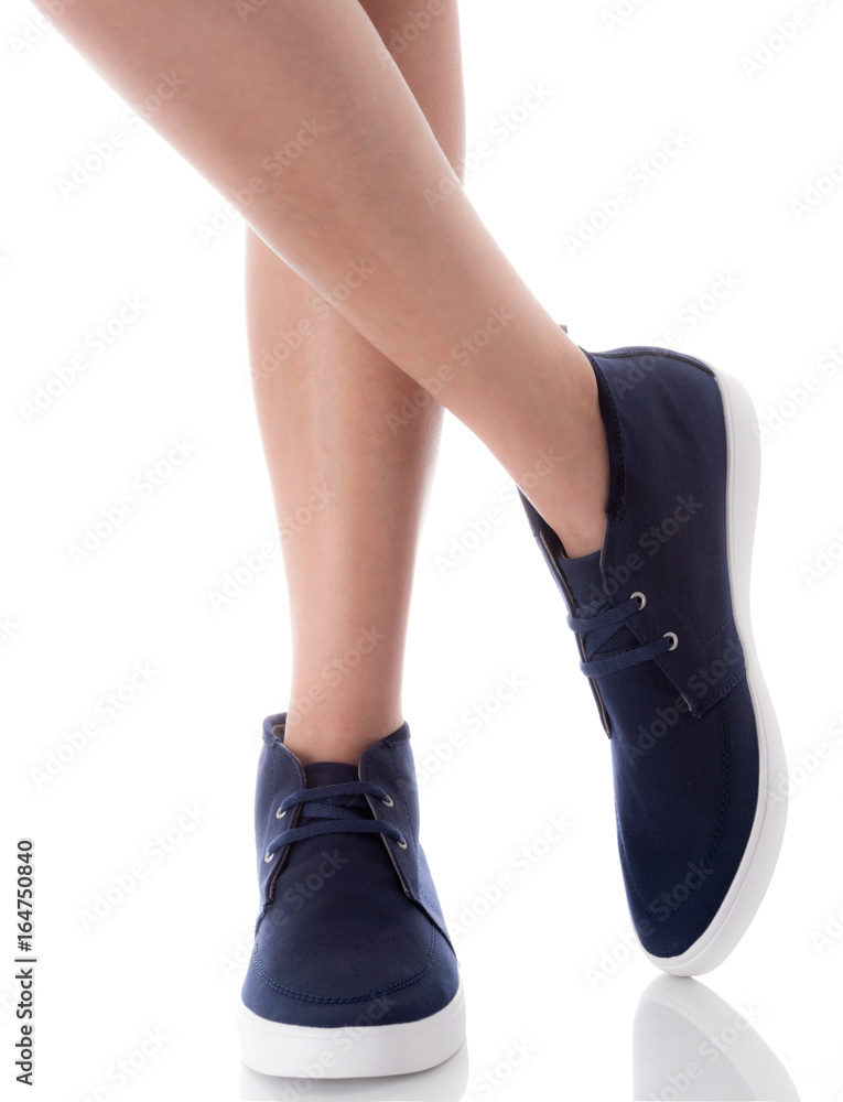 Man feet wearing blue fashion shoes in hipster style, crossing legs pose, Isolated on white background, Men's Fashion concept.