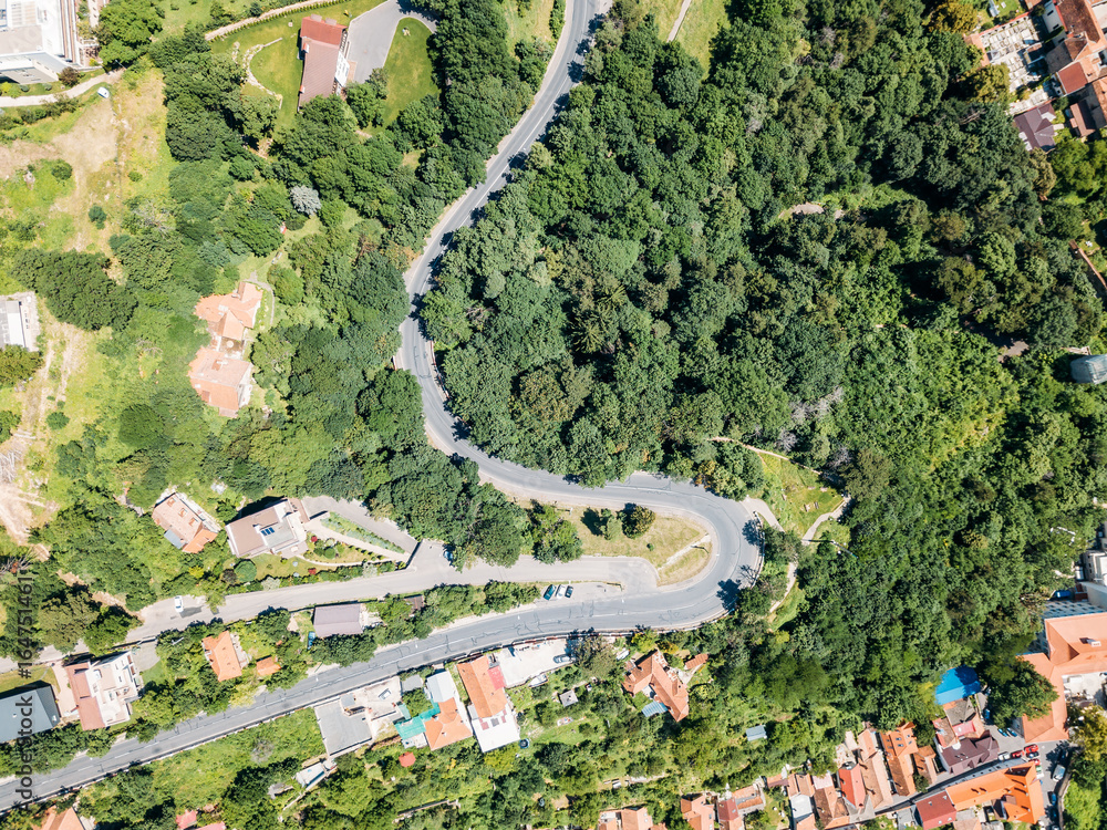 Aerial View Of Road Running Through Carpathian Mountains Forest