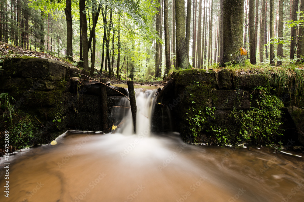 Small waterfall at the pond Small waterfall at the pond