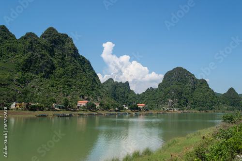 Limestone Landscape with River, Boat and Village, Dong Hoi, Vietnam