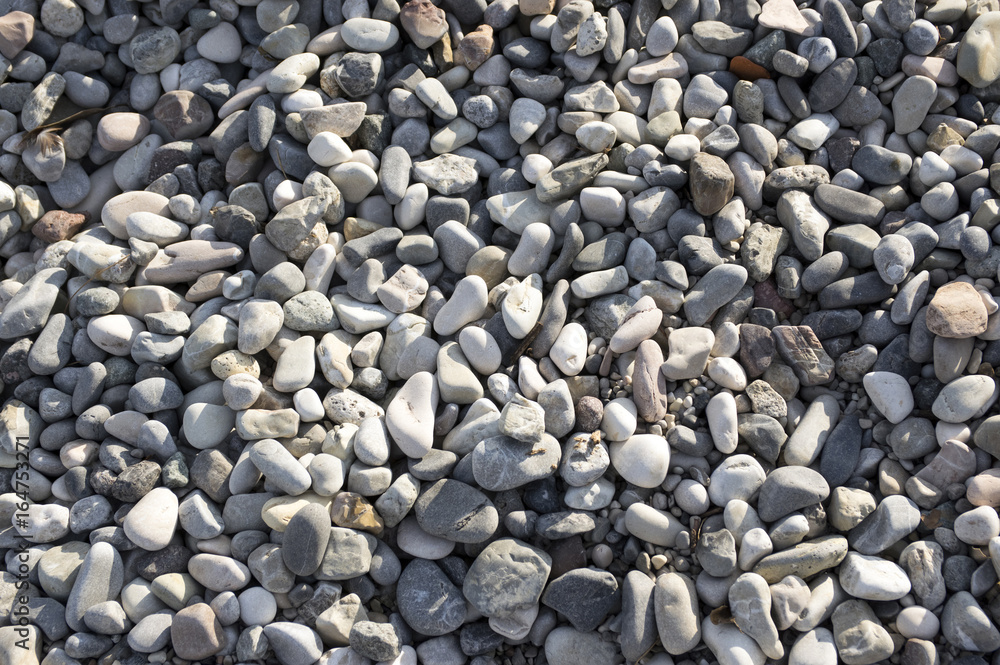 Group of white, grey and light brown stones background, pebbles beach Group of white, grey and light brown stones background, pebbles beach