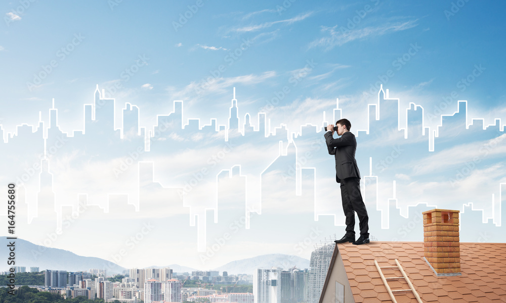 Businessman standing on roof and looking in binoculars. Mixed media Businessman standing on roof and looking in binoculars. Mixed media