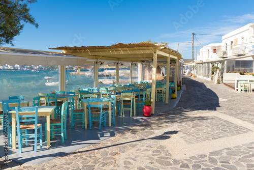 Chairs with tables in typical Greek tavern in Pollonia village on Milos Island. Greece. photo