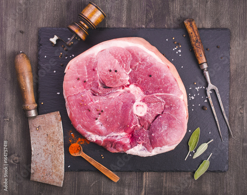 Raw ham cut and kitchen utensils top view