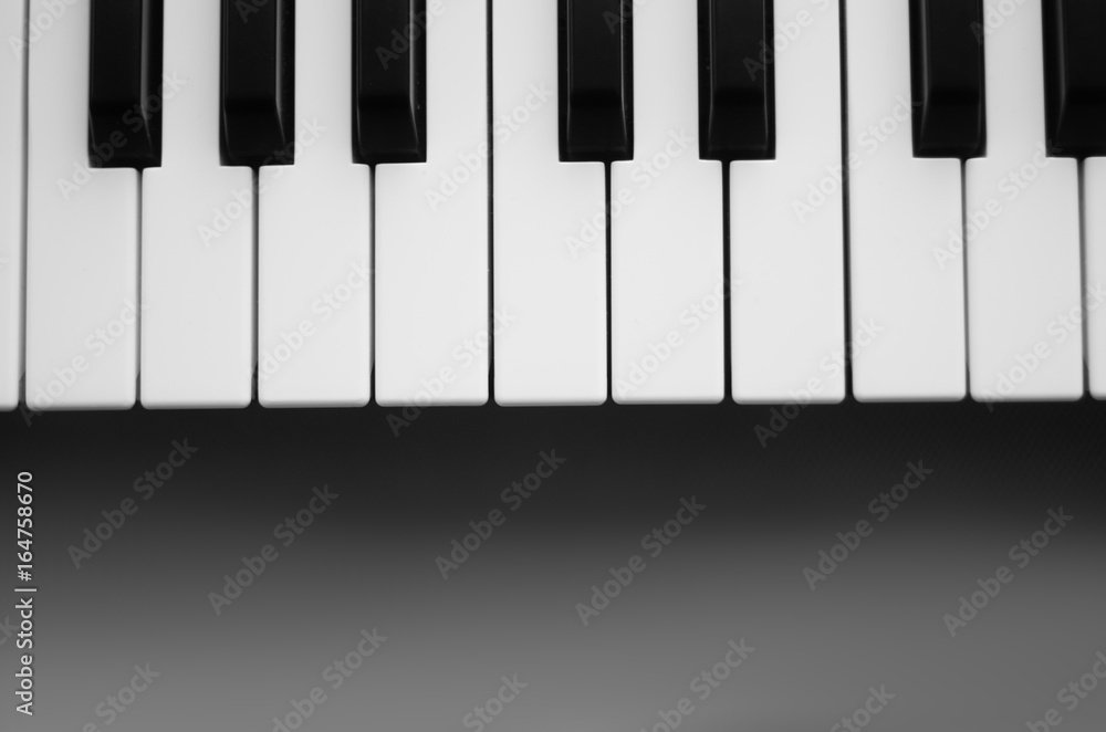 Keyboard synthesizer on a gray background Keyboard synthesizer on a gray background