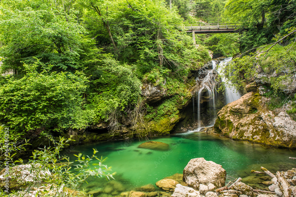Waterfall at the Vintgar gorge, beauty of nature, with river Radovna flowing through, near Bled, Slovenia