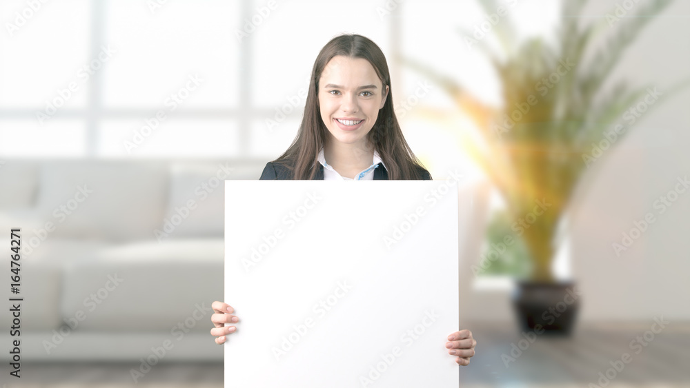 Young beautiful business woman and creative designer standing over blured interior background Young beautiful business woman and creative designer standing over blured interior background