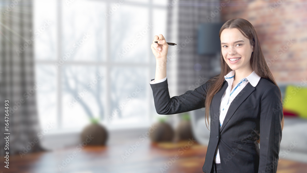 Young beautiful business woman and creative designer standing over blured interior background Young beautiful business woman and creative designer standing over blured interior background