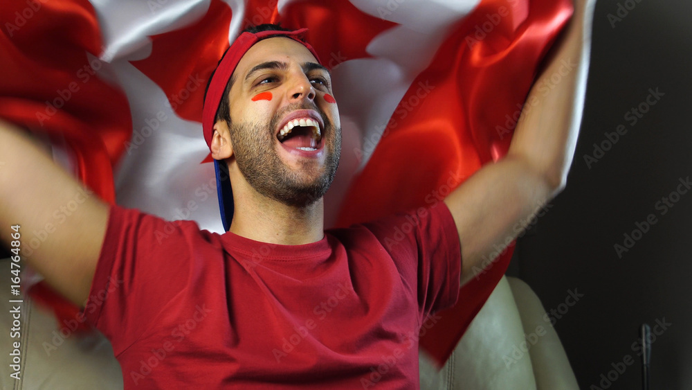 Fototapeta premium Canadian Guy Waving Canada Flag