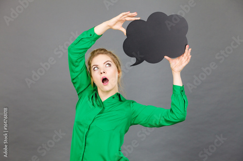 Shocked business woman with thinking bubble
