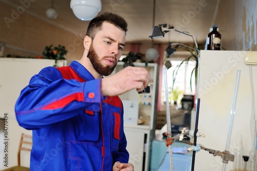 A young scientist conducts chemical experiments in the laboratory