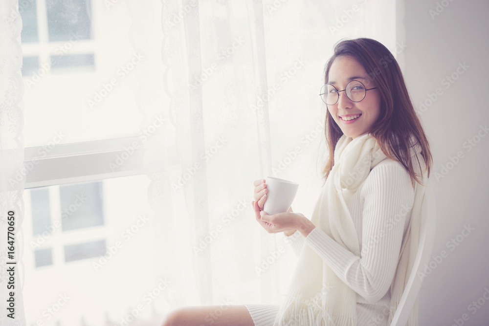 Portrait of bedroom concept: asian woman holding a cup of coffee with on bedroom in breakfast time. Portrait of bedroom concept: asian woman holding a cup of coffee with on bedroom in breakfast time.