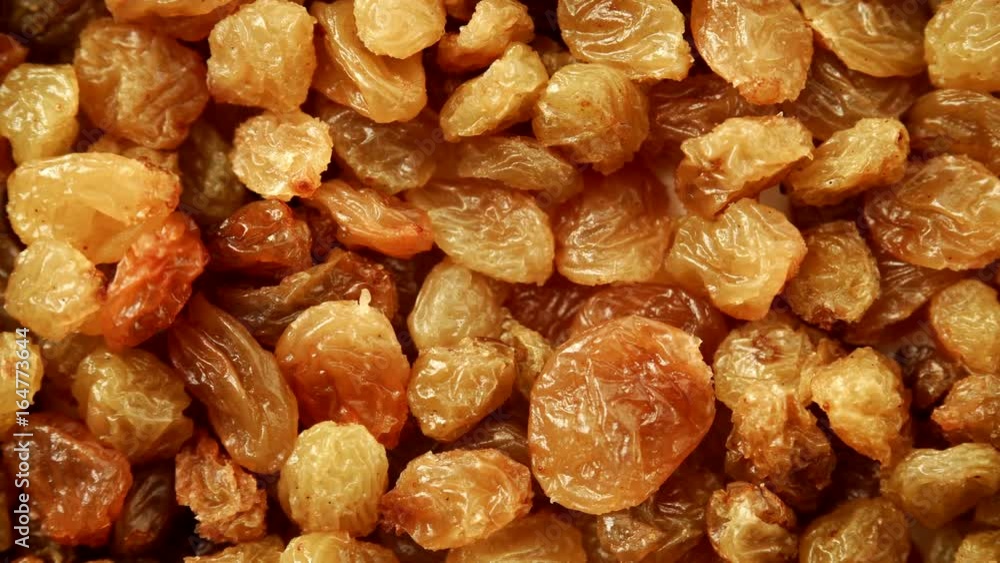 Raisin dried grape as background texture. Healthy food organic nutrition. Dolly slider shot 4K ProRes HQ codec Raisin dried grape as background texture. Healthy food organic nutrition. Dolly slider shot 4K ProRes HQ codec