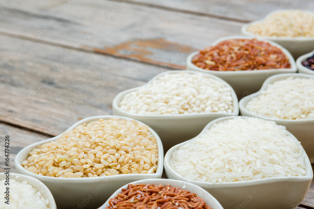 Different rice in white ceramic bowl Different rice in white ceramic bowl
