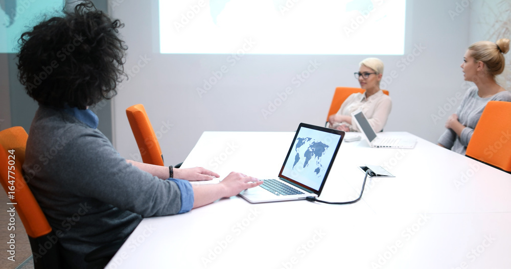Startup Business Team At A Meeting at modern office building Startup Business Team At A Meeting at modern office building