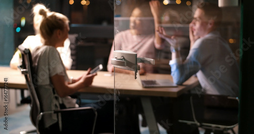 Multiethnic startup business team in night office