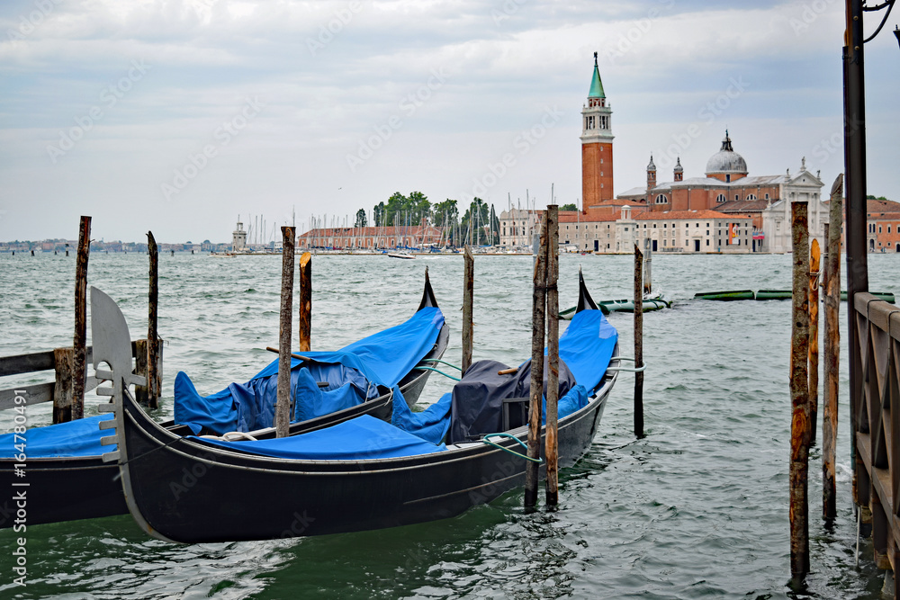 Gondolas near San Marco Piazza in Venice,Italy.. View towards San Giorgio Maggiore 