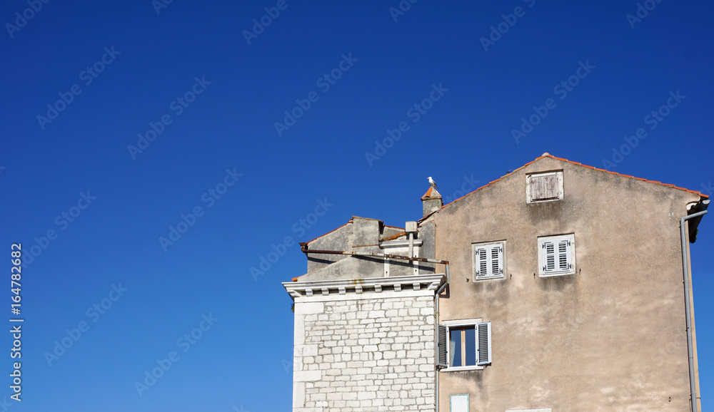 Heritage old building agaist blue sky in Rovinj