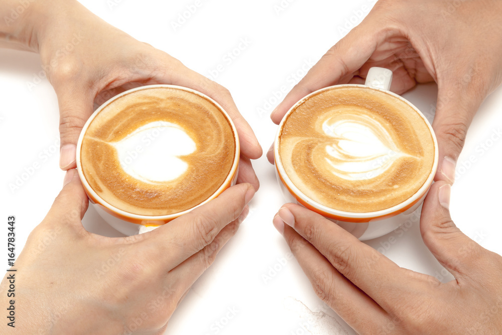 Coffee cups of latte art heart shape, drinking together, on white background isolated
