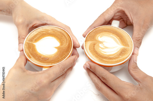 Obraz na płótnie Coffee cups of latte art heart shape, drinking together, on white background isolated w salonie