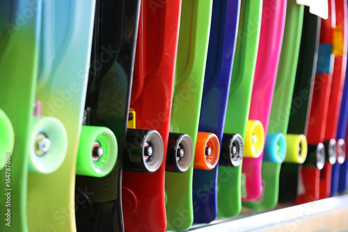 colorful skateboards are sold in the store. bright and vibrant colors. center focus photography
