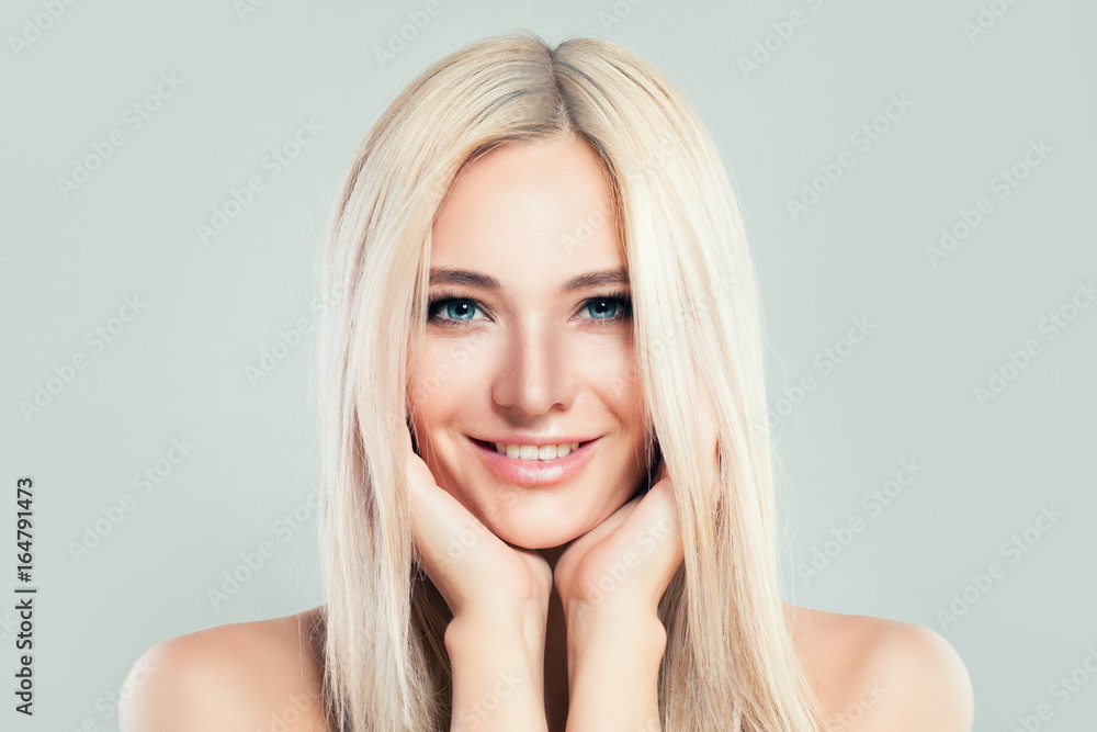 Blonde Model Woman with Healthy Skin and Blonde Hairstyle. Cute Female Face. Spa Beauty, Facial Treatment and Cosmetology Concept Blonde Model Woman with Healthy Skin and Blonde Hairstyle. Cute Female Face. Spa Beauty, Facial Treatment and Cosmetology Concept