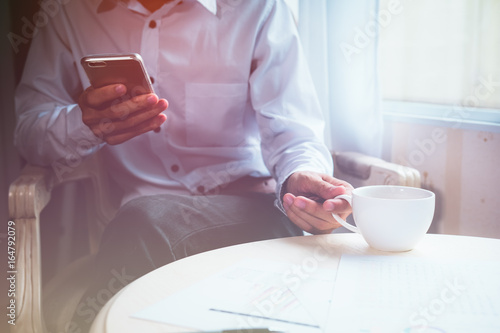 Handsome business man working at the office, business concept
