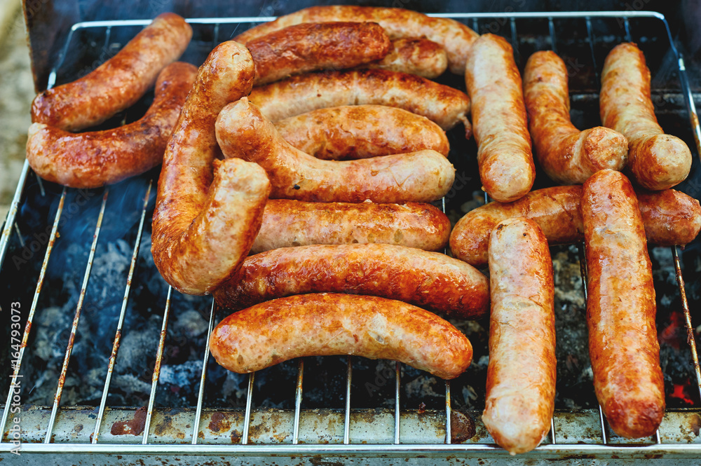 sausages of meat cooking on the grill .Barbecue on the nature sausages of meat cooking on the grill .Barbecue on the nature