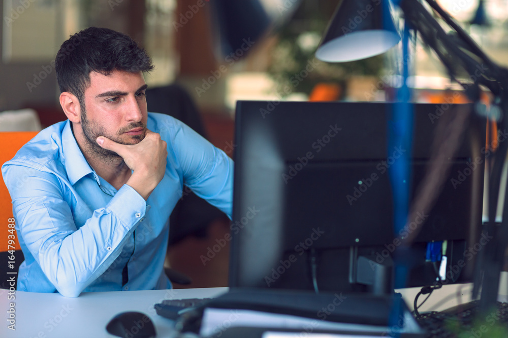 Freelance programmer working in startup office Freelance programmer working in startup office