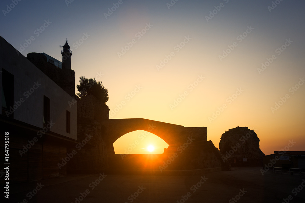 Dawn in the port of Castro Urdiales, the sun rises below the Roman bridge, Castro Urdiales, Cantabria