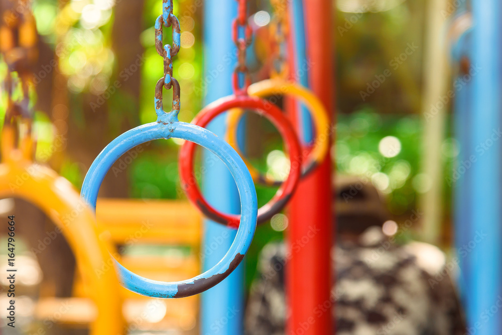 Hanging Climbing Rings In A Playground, colorful climbing ring.selective focus.