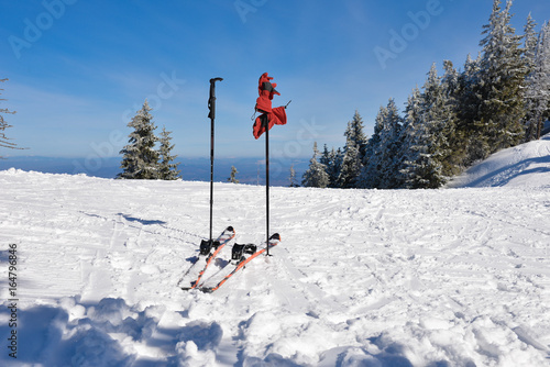 Skis on a ski slope on mountain, in winter season © cristianbalate