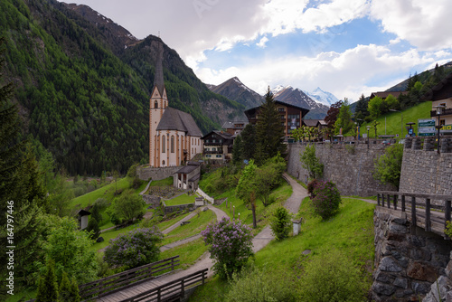 Wallpaper Mural Heiligenblut with St Vincent Church in the background the beautiful Grossglockner. Beautiful sunny summer day in Austria. Torontodigital.ca