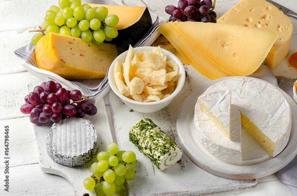 Cheese plate served with grapes Cheese plate served with grapes