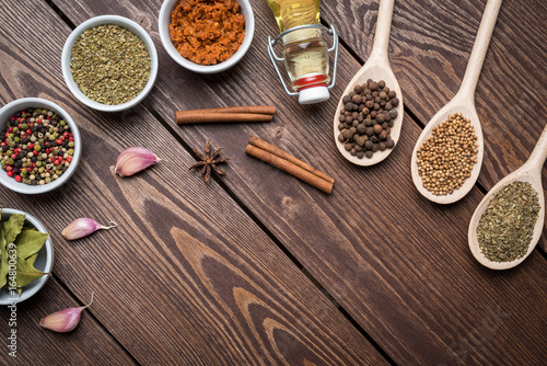 Fototapeta Naklejka Na Ścianę i Meble -  Fresh herbs and spices on wooden table. Close up