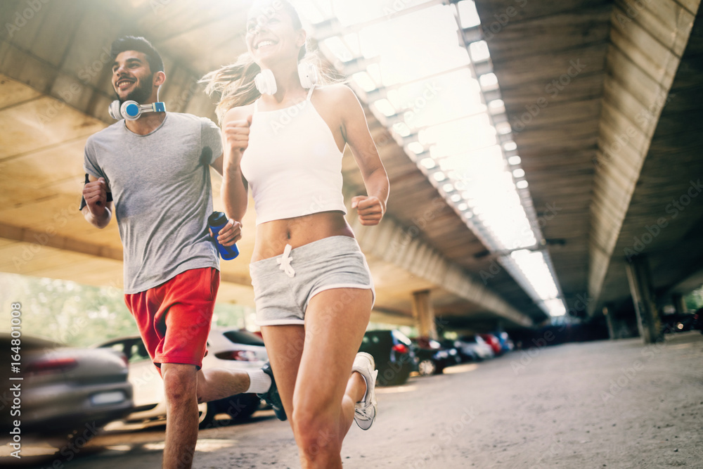 Attractive man and beautiful woman jogging together Attractive man and beautiful woman jogging together