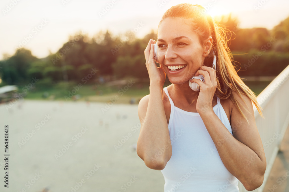 Portrait of woman taking break from jogging