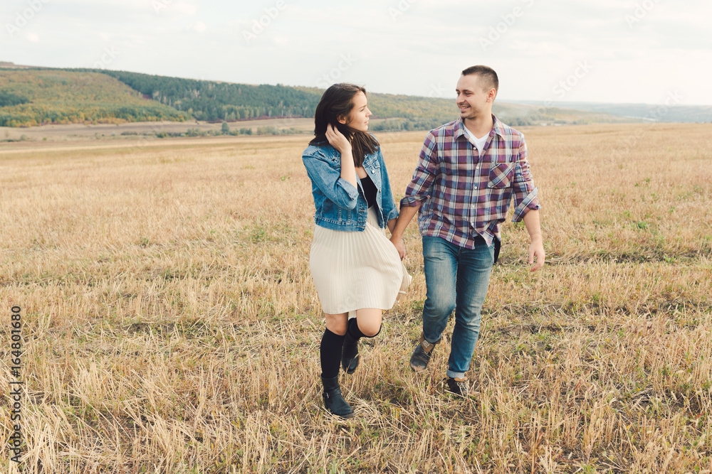 Young modern stylish couple outdoors