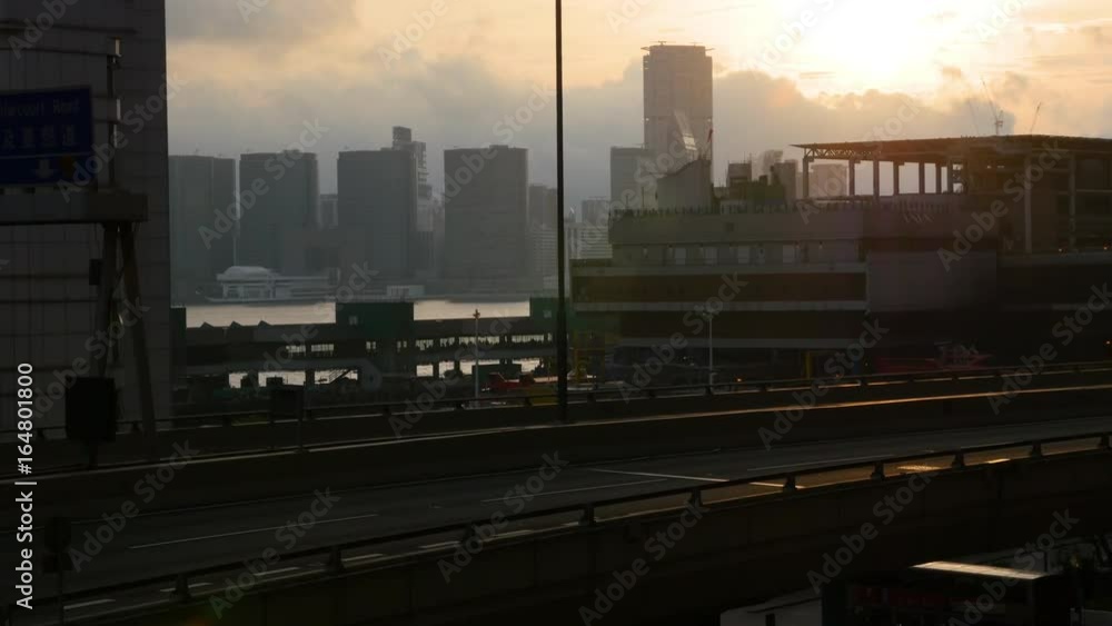 An idyllic shot of Hong Kong's highway while the sun is setting in the background. An idyllic shot of Hong Kong's highway while the sun is setting in the background.
