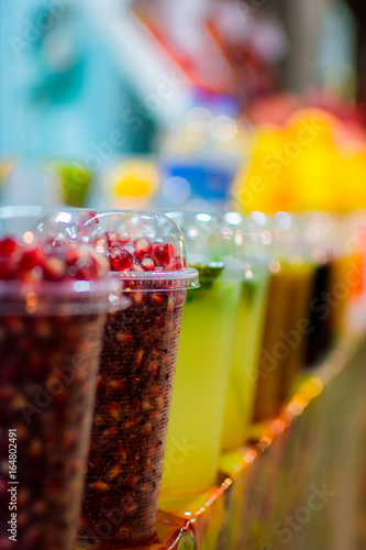 Close-Up Of fresh Fruit Juice For Sale At Market