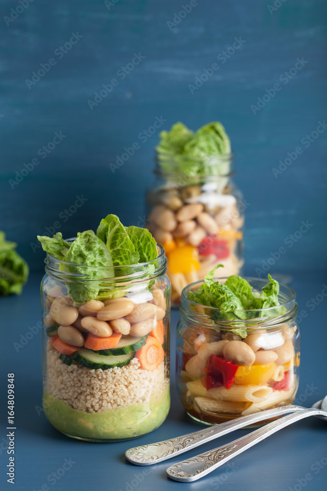 vegan couscous and pasta salad in mason jars with vegetables beans vegan couscous and pasta salad in mason jars with vegetables beans