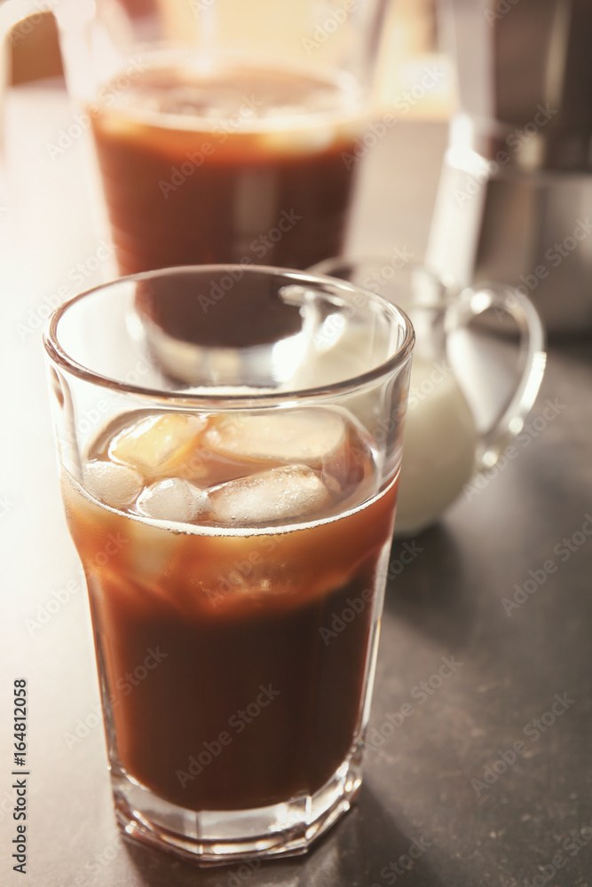 Glass of cold brew coffee on grey table Glass of cold brew coffee on grey table