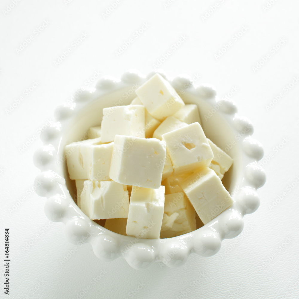 cube cheese on bowl cube cheese on bowl