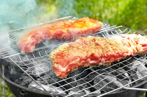Appetizing juicy spare ribs grilled outdoors