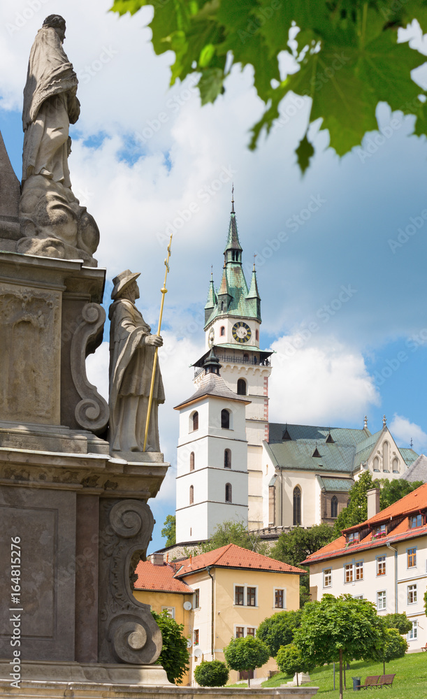 Kremnica  - The Safarikovo square and detail of the baroque Holy Trinity column by Dionyz Ignac Stanetti (1765 - 1772), castle and St. Catherine church.