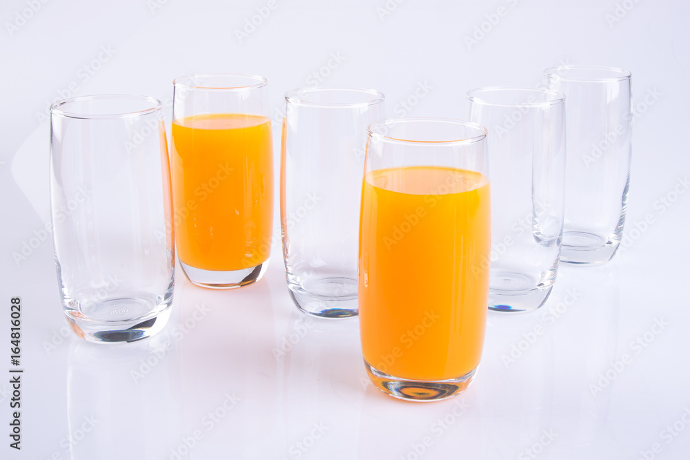 Orange juice in glasses on white background. Orange juice in glasses on white background.